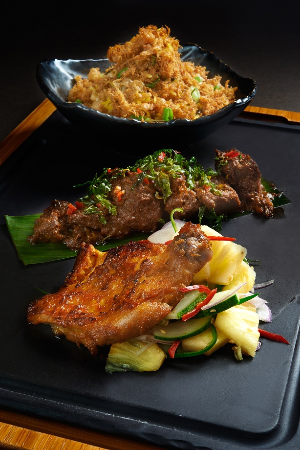 Spice egg rice with local style baked chicken and lamb rendang
