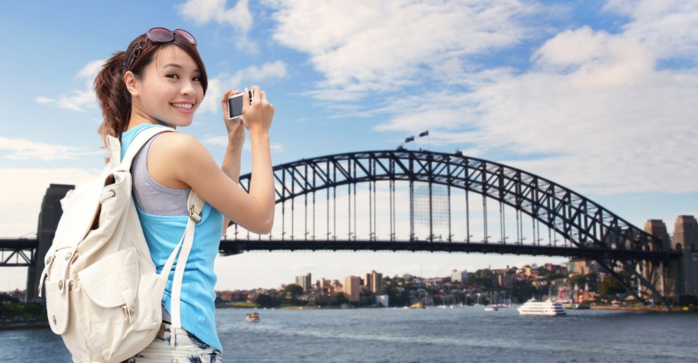Chinese tourists take in the sites of the Sydney Harbour Bridge