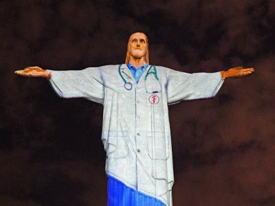 Christ the Redeemer lit up as doctor 
