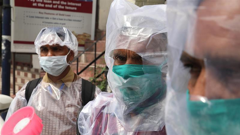 indian doctors wear raincoats