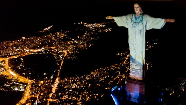 Christ the Redeemer lit up as doctor 