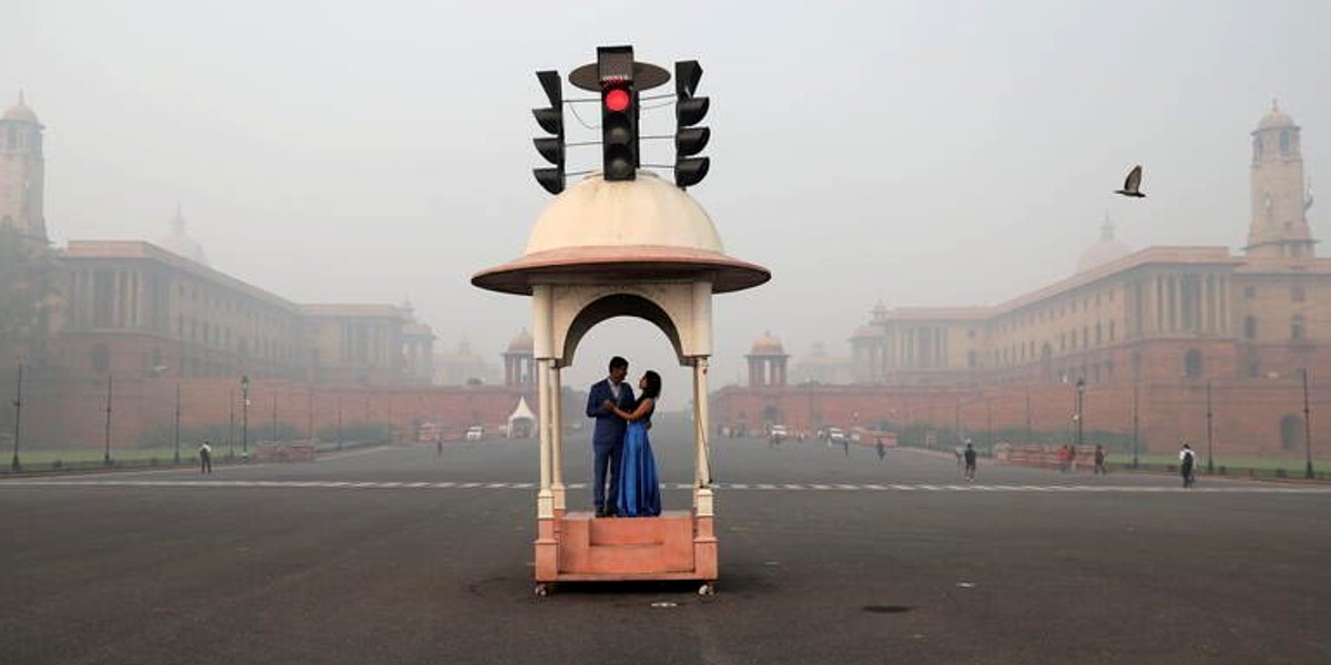 Couple Pose For Pre-Wedding Shoot Surrounded By Delhi Smog & The Results Are Eye-Watering