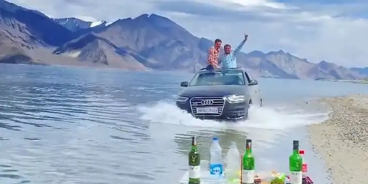 Tourists Driving Audi In Ladakh’s Pangong Lake With Alcohol Bottles Shocks Netizens