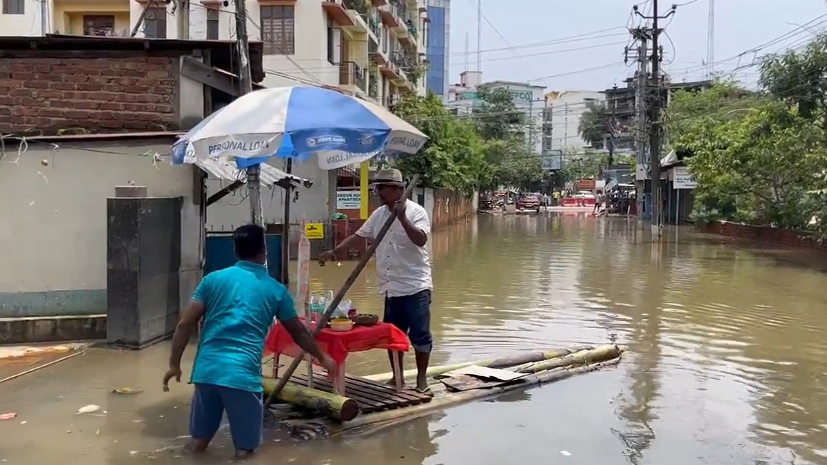 Man Creates Floating Shop With Raft & Plastic Table Amid Heartbreaking Assam Floods