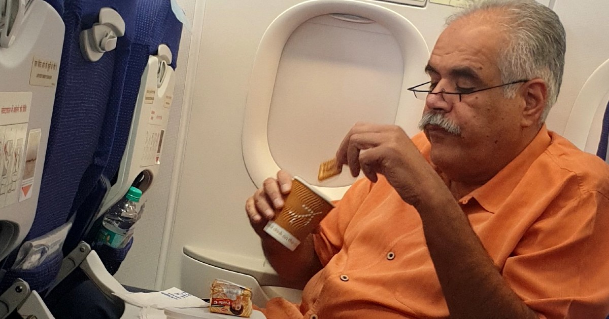 Picture Of IndiGo MD Humbly Having Tea And Parle-G Onboard Is Earning Praises From The Internet