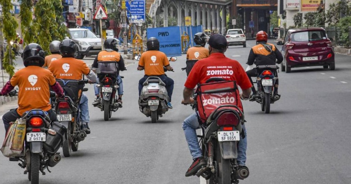 Swiggy Delivery Man On Scooter Helps Zomato Delivery Man On Cycle