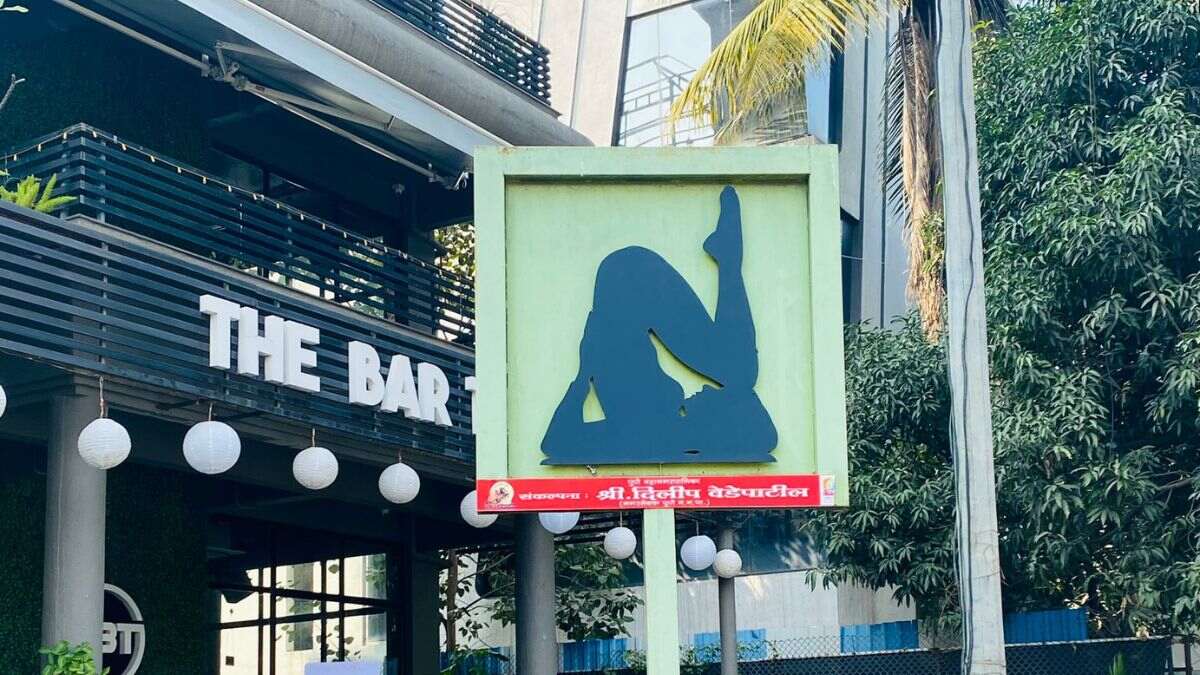 Strip Club Or Yoga? Twitter User Spots A Hoarding Outside Pune Bar & Tweeple Are Debating What It Is!