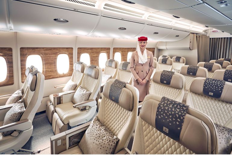 Emirates flight attendant inside the Emirates Premium Economy cabin