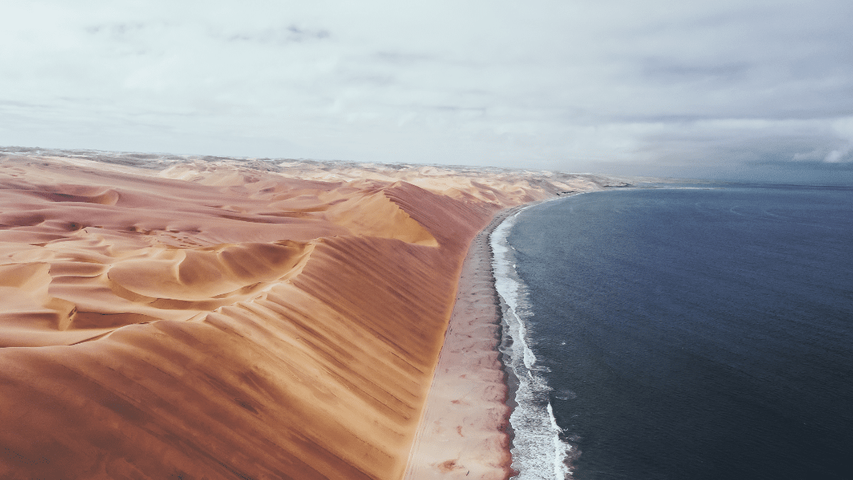 Explore Namibia’s Sandwich Harbour, A Place Where The Atlantic Ocean Meets The Sand Dunes