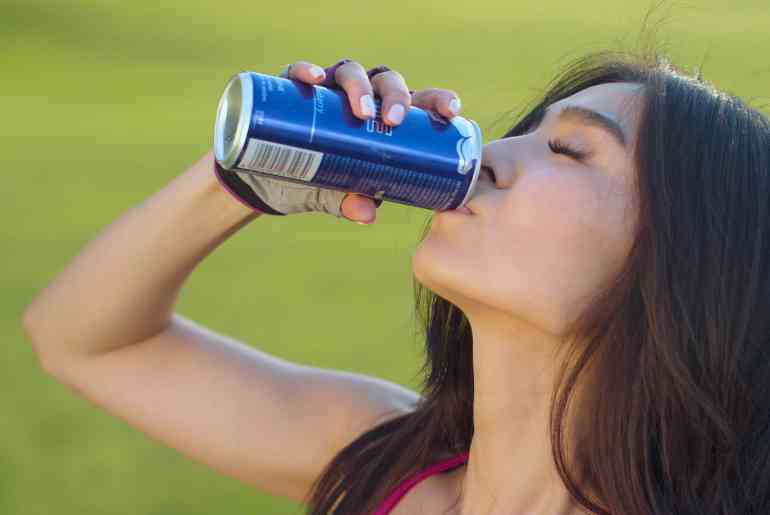 woman drinking soft drink