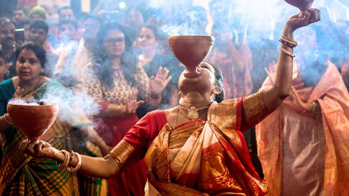 Durga Puja 2025: What Is The Significance Of Dhunuchi Naach And Why Is It The Heartbeat Of Pujo Nights?