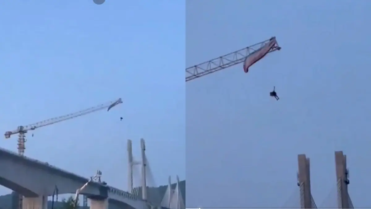 Paraglider Stuck 60 Metres Mid-Air After Strong Wind Lands Him On Crane In China